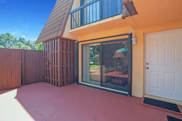 an aerial view of multiple houses with yard