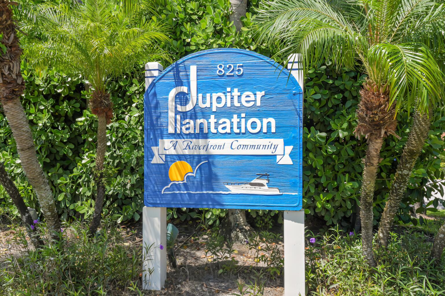 825 Center Street, Unit 14A Jupiter, FL 33458 - Photo 32 of 57 a sign that is on a brick wall