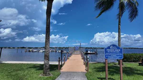 a view of a swimming pool and lounge chairs