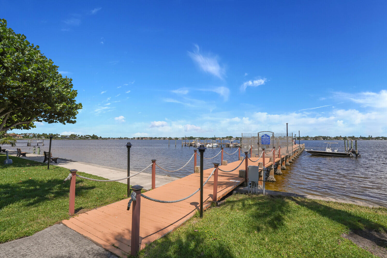 825 Center Street, Unit 14A Jupiter, FL 33458 - Photo 40 of 57 an outdoor view of a house with swimming pool and sitting area