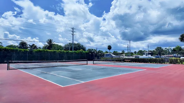 an aerial view of ocean with residential house with outdoor space