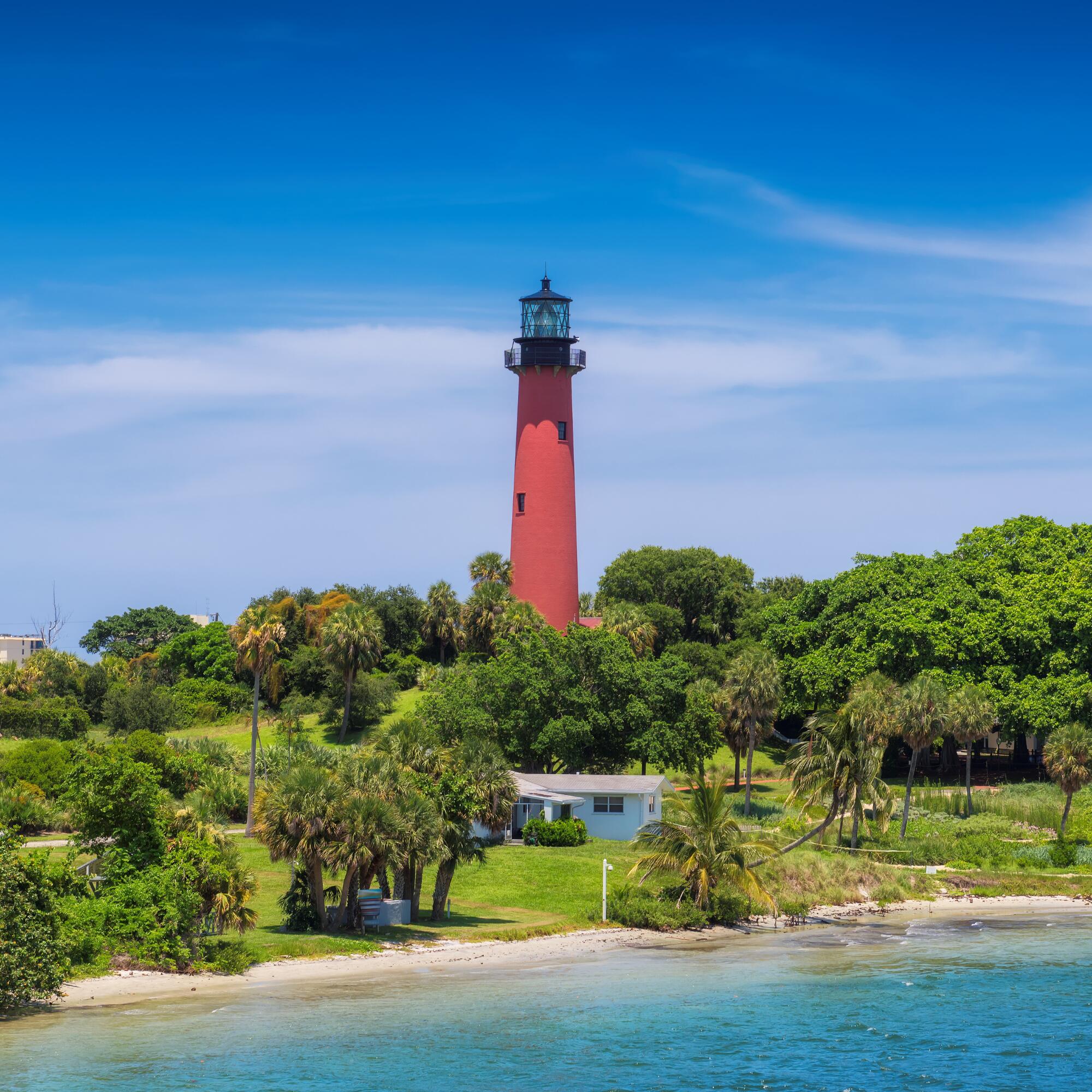 825 Center Street, Unit 14A Jupiter, FL 33458 - Photo 50 of 57 a front view of a house with a yard and lake view