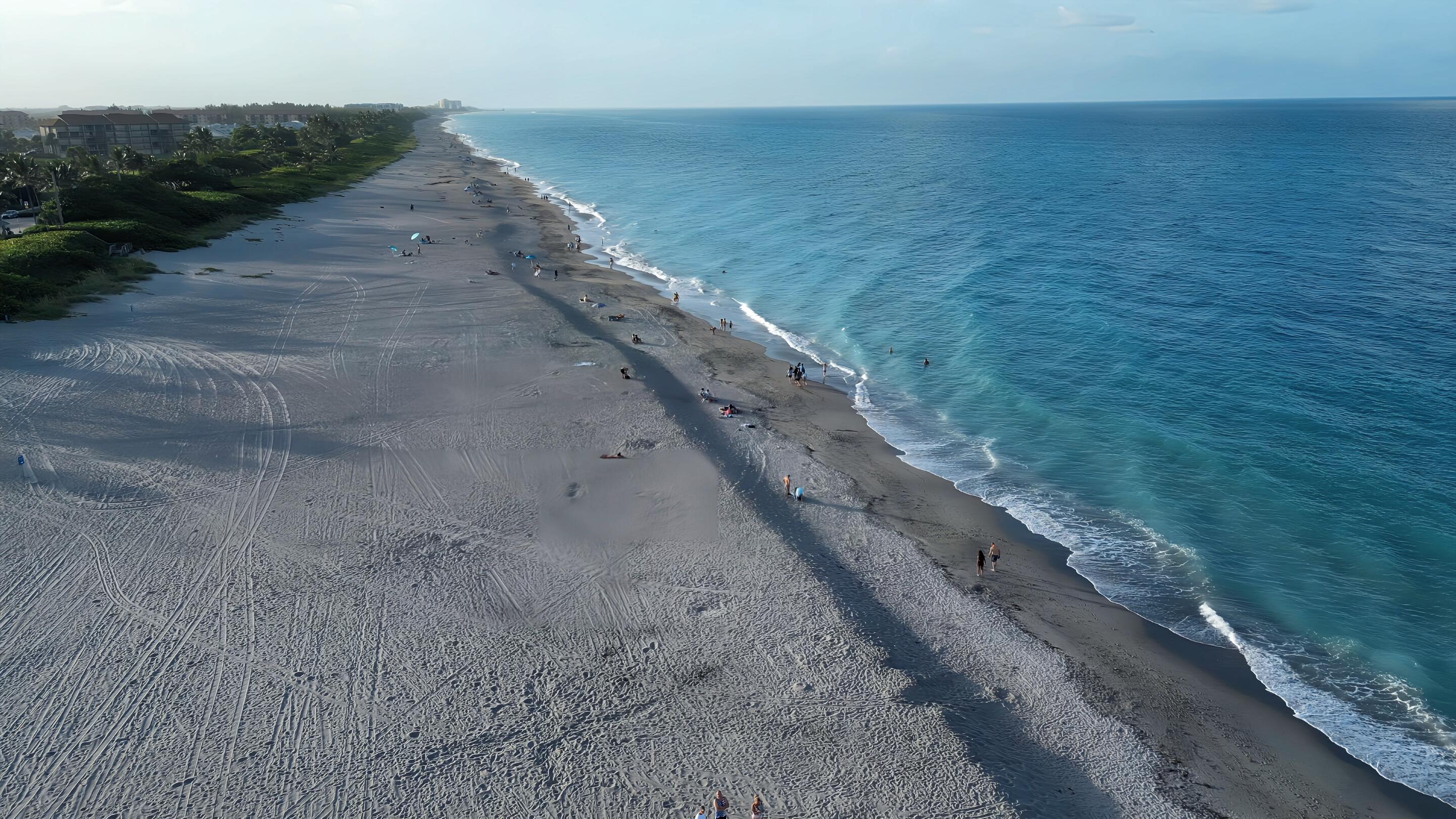 825 Center Street, Unit 14A Jupiter, FL 33458 - Photo 56 of 57 a view of a beach with wooden floor