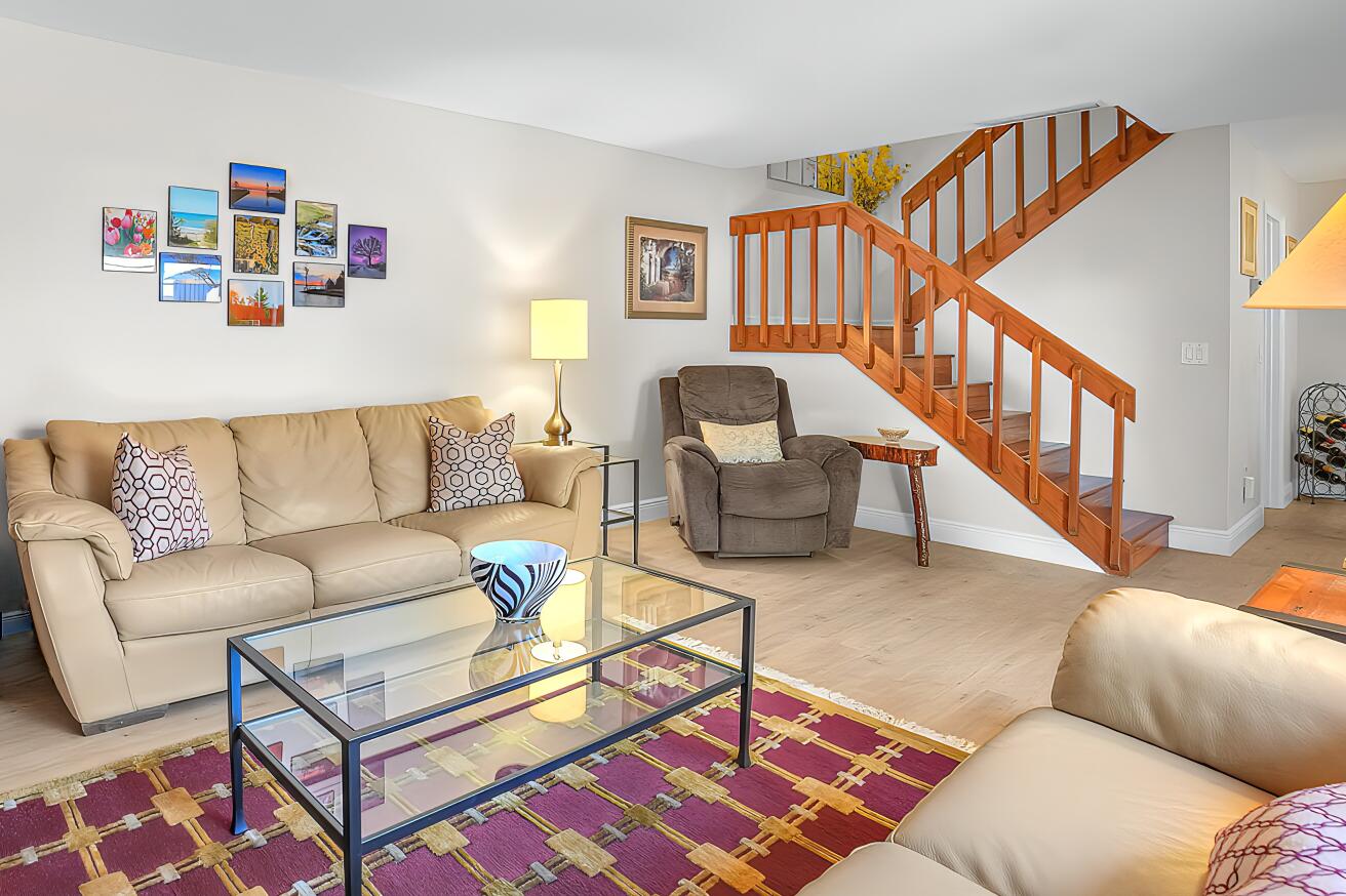 825 Center Street, Unit 14A Jupiter, FL 33458 - Photo 7 of 57 a living room with furniture and a rug