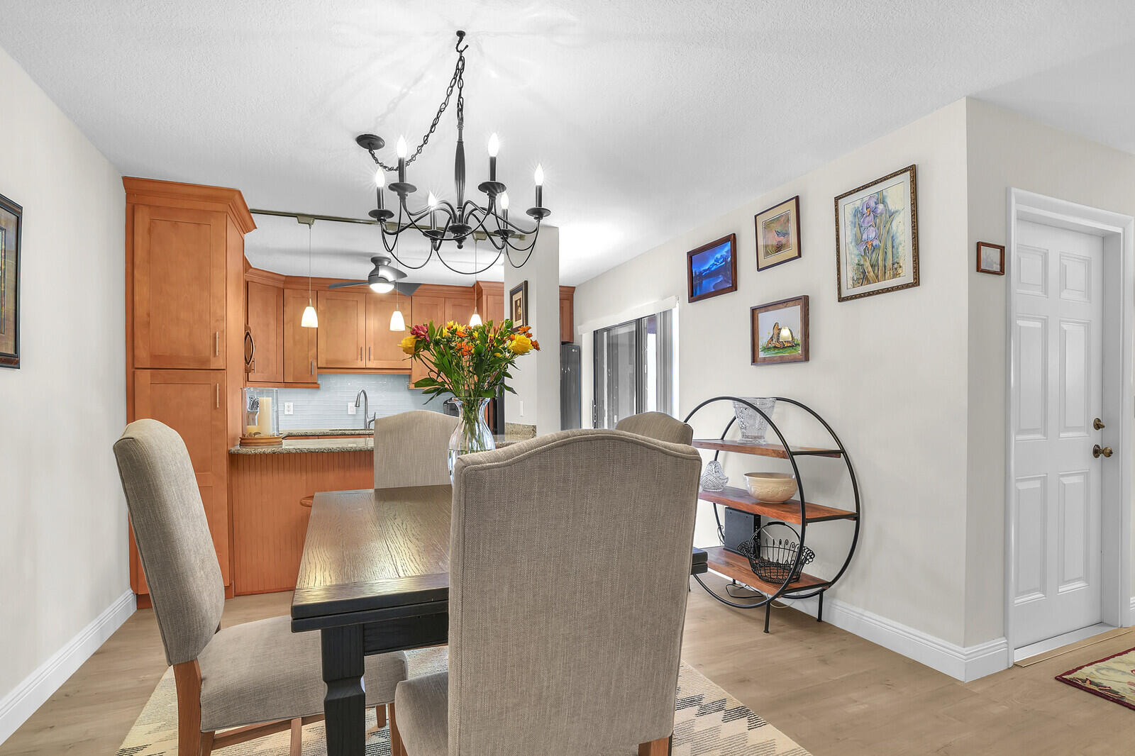 825 Center Street, Unit 14A Jupiter, FL 33458 - Photo 10 of 57 a dining room filled with furniture and chandelier