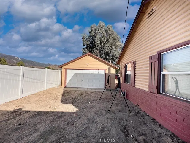 a house view with a backyard space