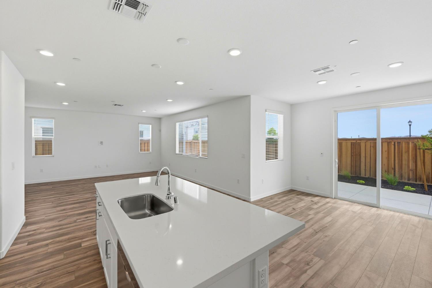 1270 Ribiolo Lane Mountain House, CA 95391 - Photo 5 of 13 a kitchen with a sink and refrigerator