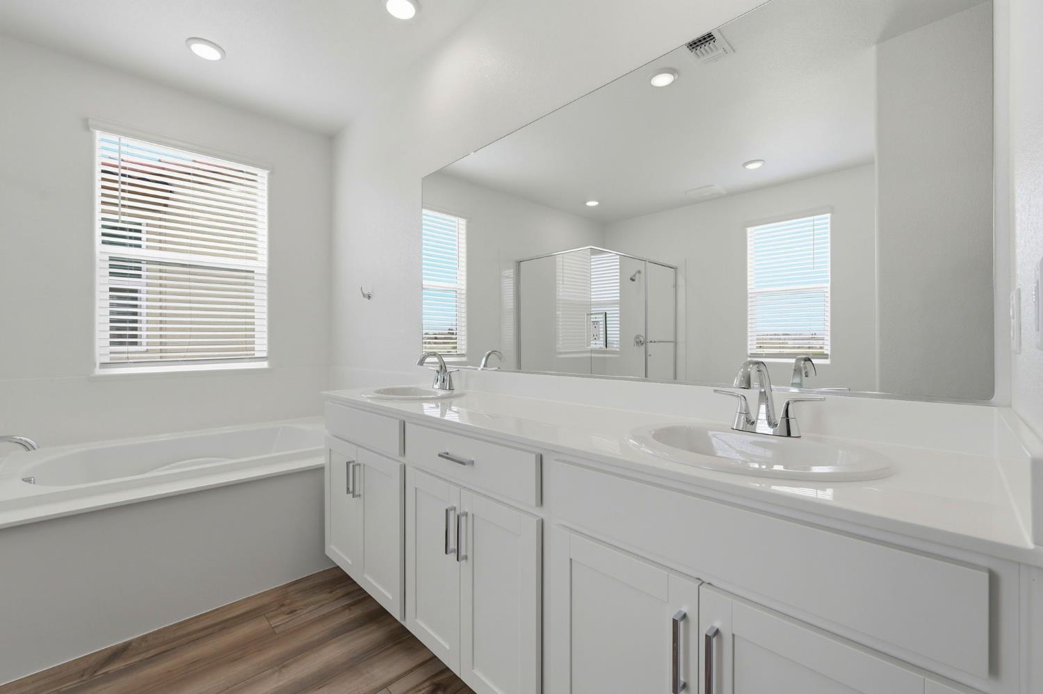 1270 Ribiolo Lane Mountain House, CA 95391 - Photo 9 of 13 a bathroom with a sink double vanity granite tub and a mirror