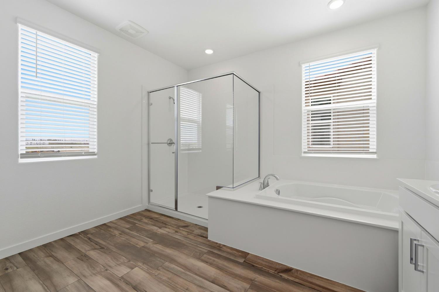 1270 Ribiolo Lane Mountain House, CA 95391 - Photo 10 of 13 a bathroom with a granite countertop sink and a mirror