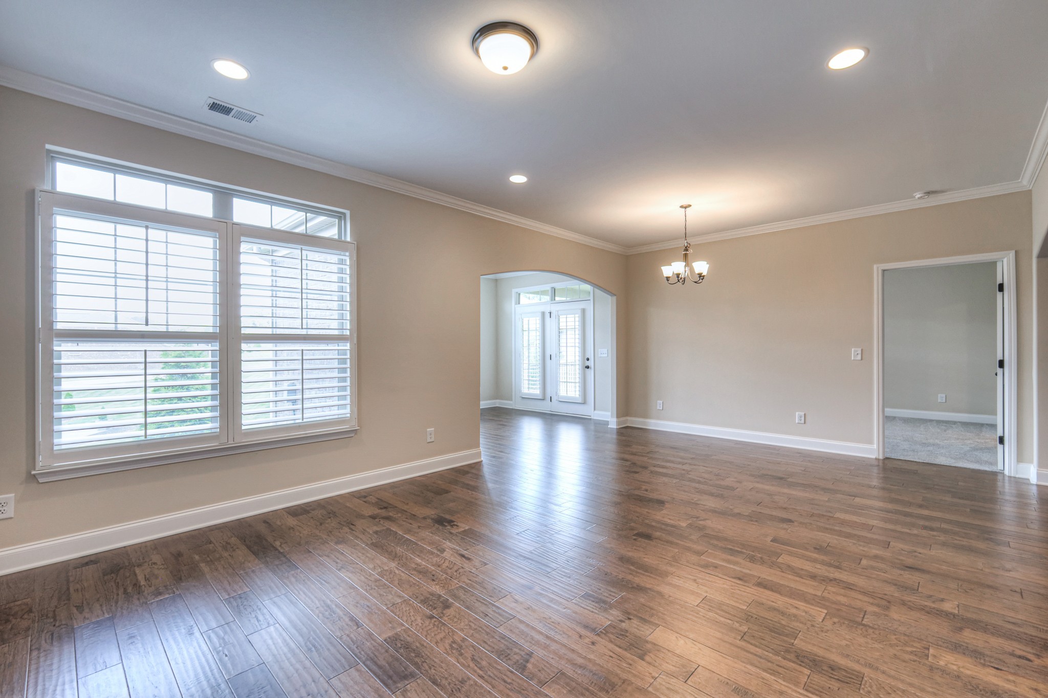 213 Vintage Way Lebanon, TN 37087 - Photo 15 of 33 a view of an empty room with wooden floor and a window
