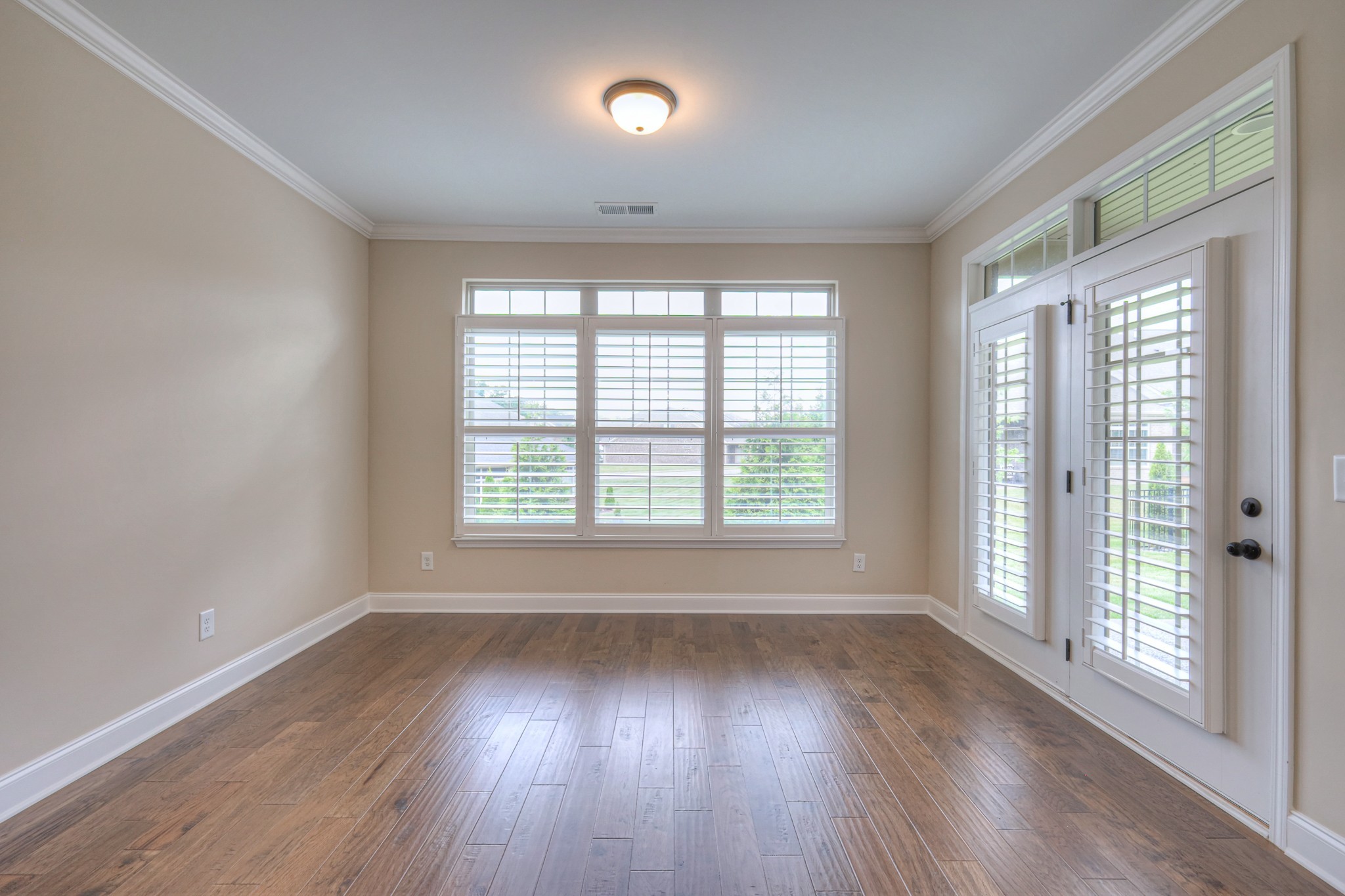 213 Vintage Way Lebanon, TN 37087 - Photo 17 of 33 a view of an empty room with wooden floor and a window