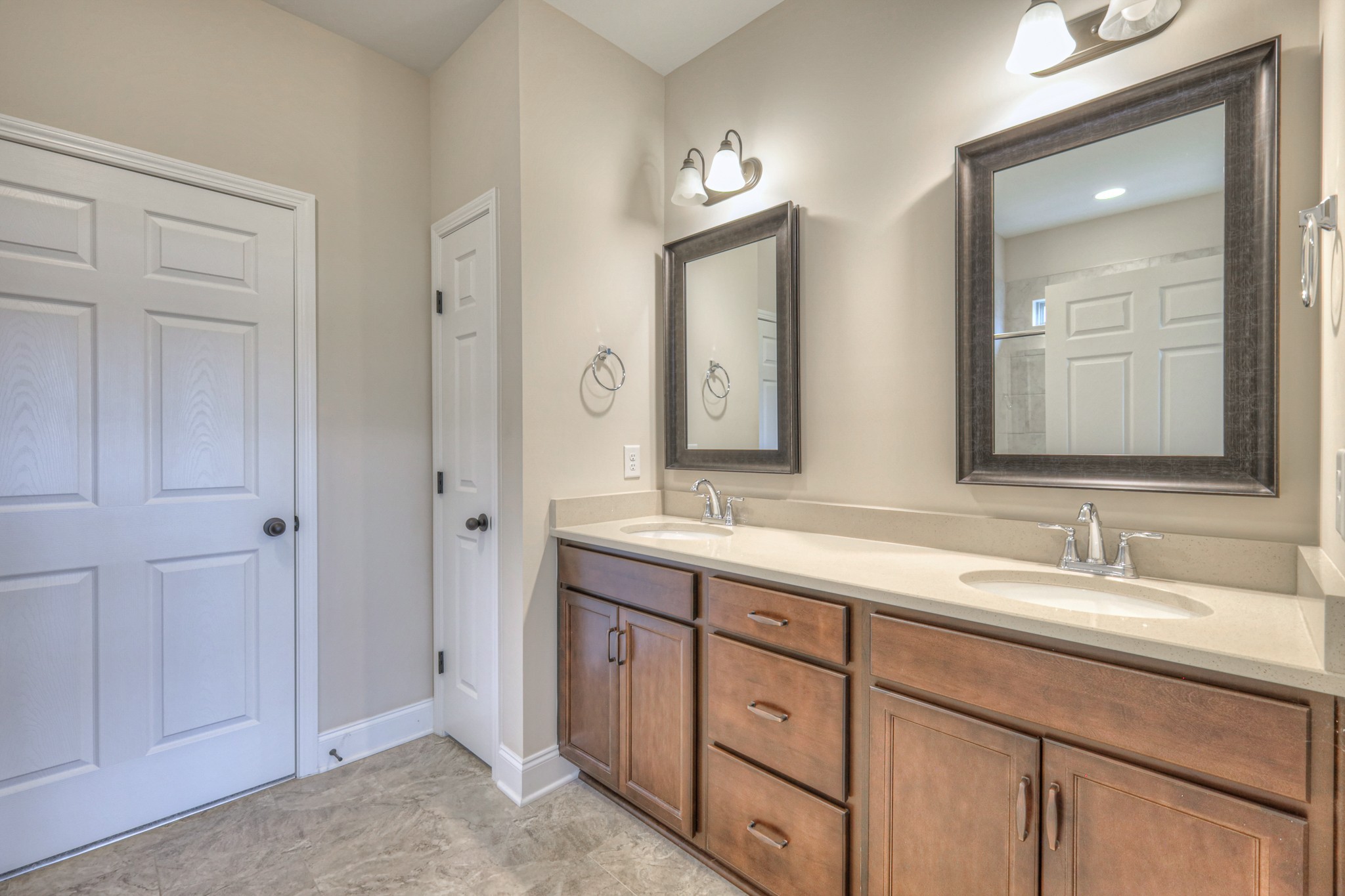 213 Vintage Way Lebanon, TN 37087 - Photo 20 of 33 a bathroom with double vanity sinks and a mirror