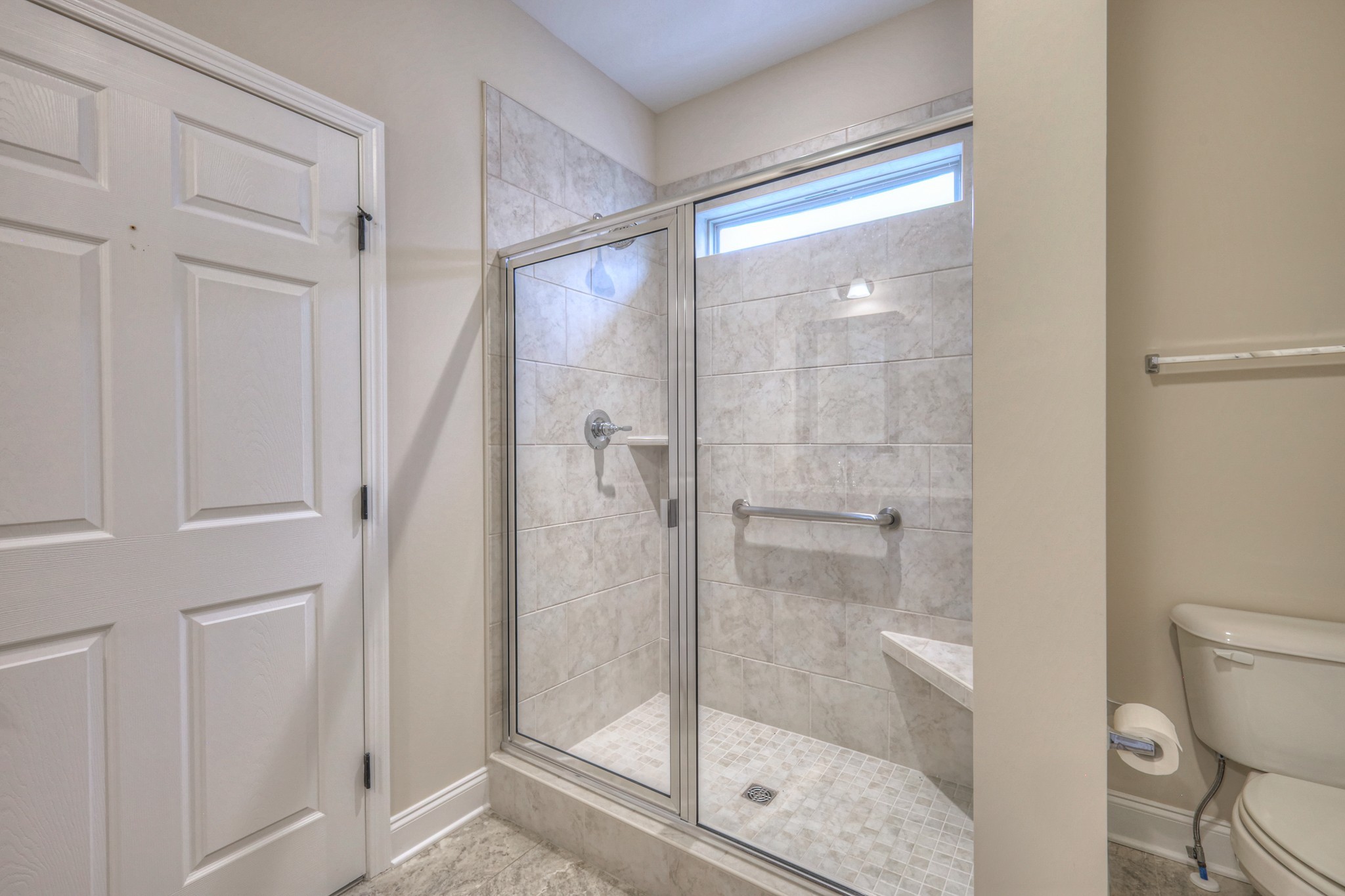 213 Vintage Way Lebanon, TN 37087 - Photo 21 of 33 a bathroom with a glass shower door