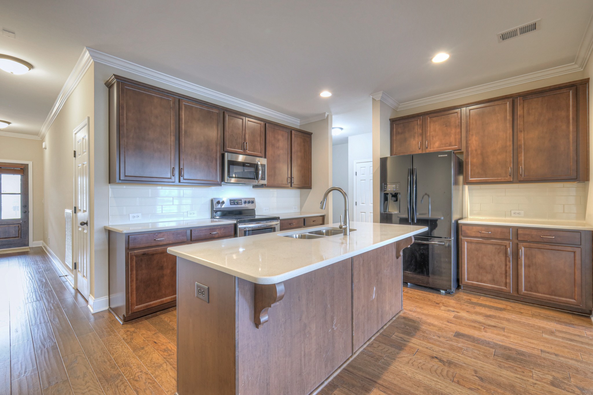 213 Vintage Way Lebanon, TN 37087 - Photo 6 of 33 a kitchen with a sink stove and refrigerator