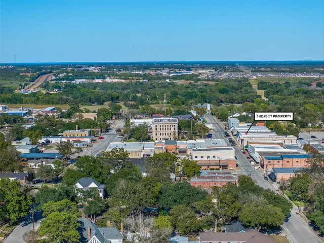 a lobby with furniture and a rug