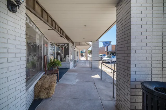 a view of a hallway with dining area