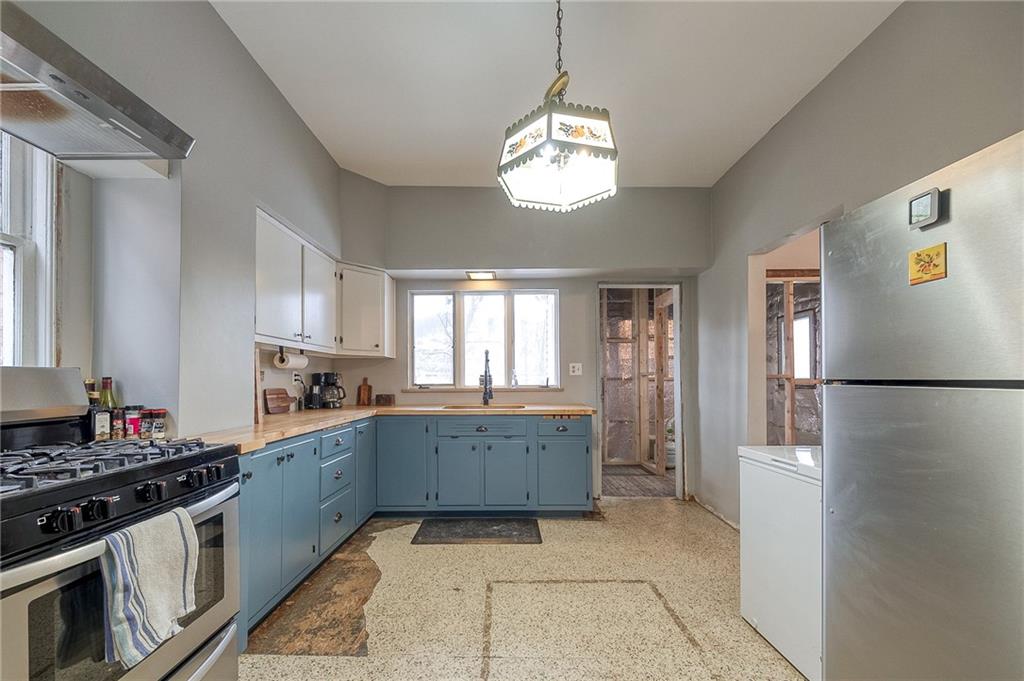 232 Chadwick Street Sewickley, PA 15143 - Photo 12 of 36 a kitchen with stainless steel appliances granite countertop a refrigerator and a stove top oven