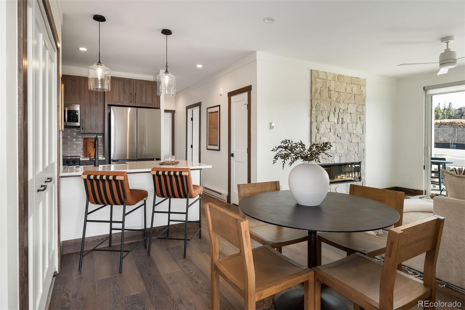 340 Sterling Loop, Unit 1 Fraser, CO 80442 - Photo 1 of 28 a dining room with furniture and wooden floor