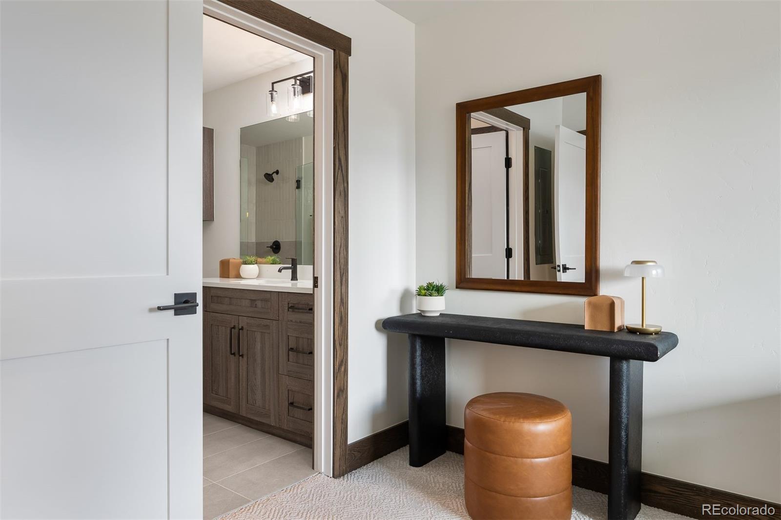 340 Sterling Loop, Unit 1 Fraser, CO 80442 - Photo 16 of 28 a view of bathroom with a sink and mirror
