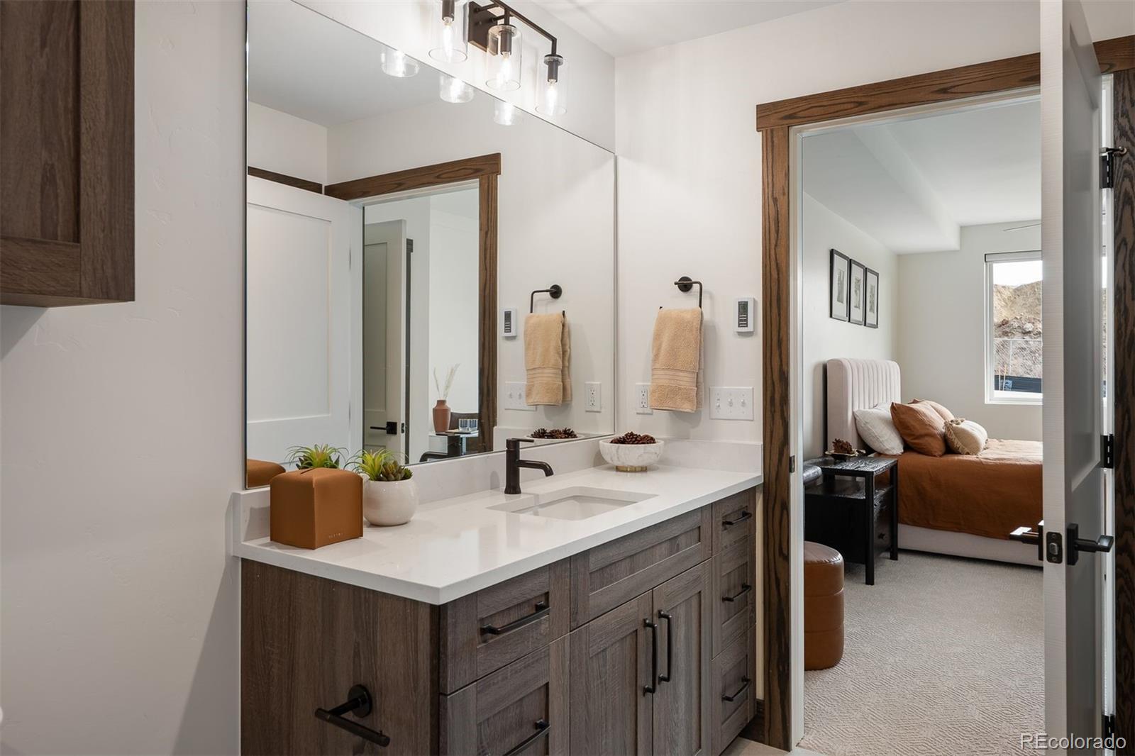 340 Sterling Loop, Unit 1 Fraser, CO 80442 - Photo 17 of 28 a bathroom with a sink double vanity and a mirror