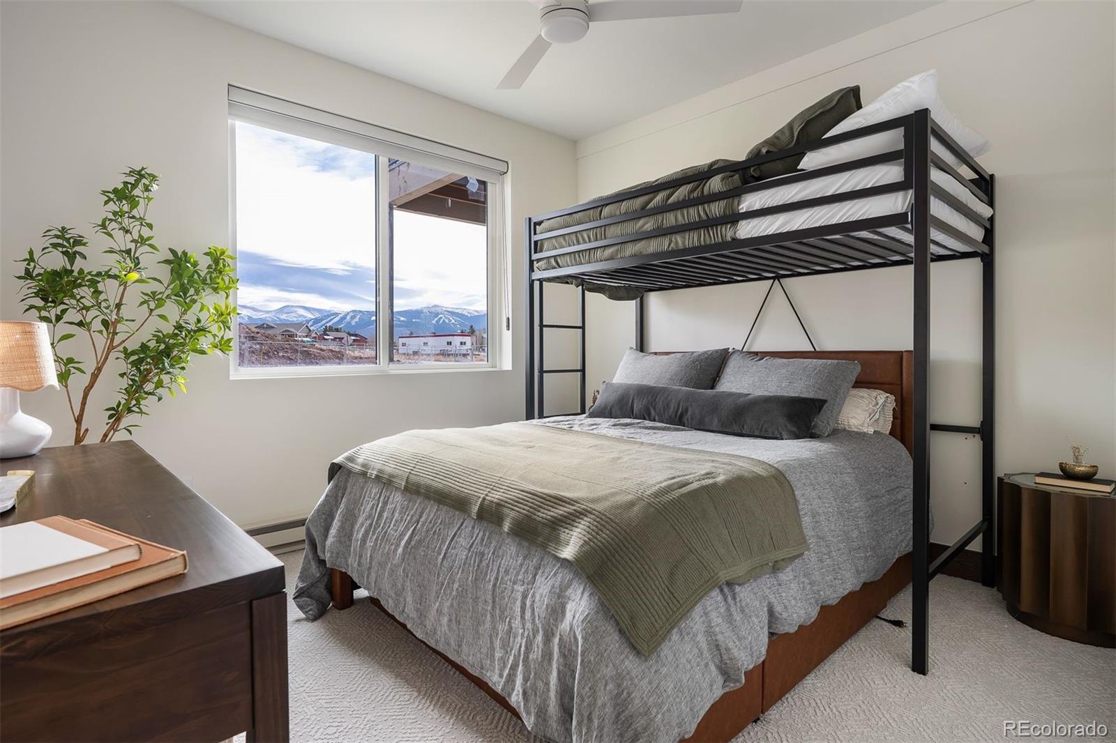 340 Sterling Loop, Unit 1 Fraser, CO 80442 - Photo 19 of 28 a bedroom with a bed and a window