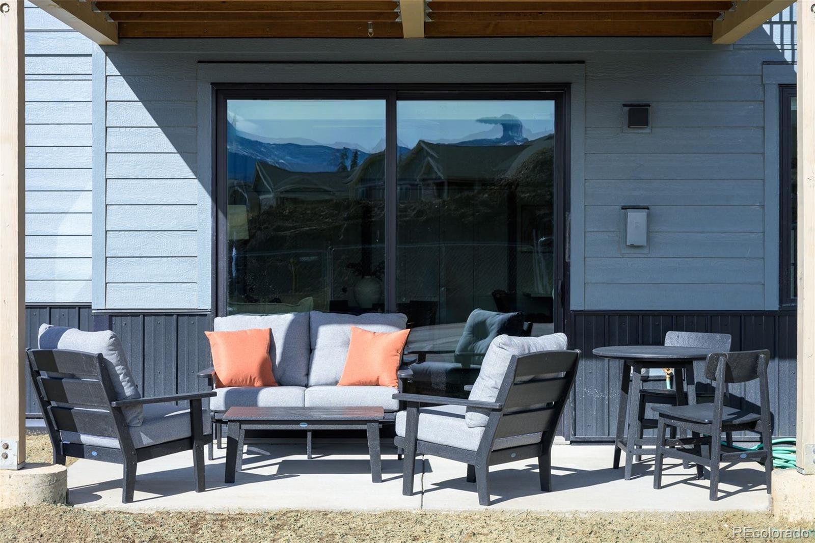 340 Sterling Loop, Unit 1 Fraser, CO 80442 - Photo 23 of 28 a outdoor space with patio the couches and a potted plant