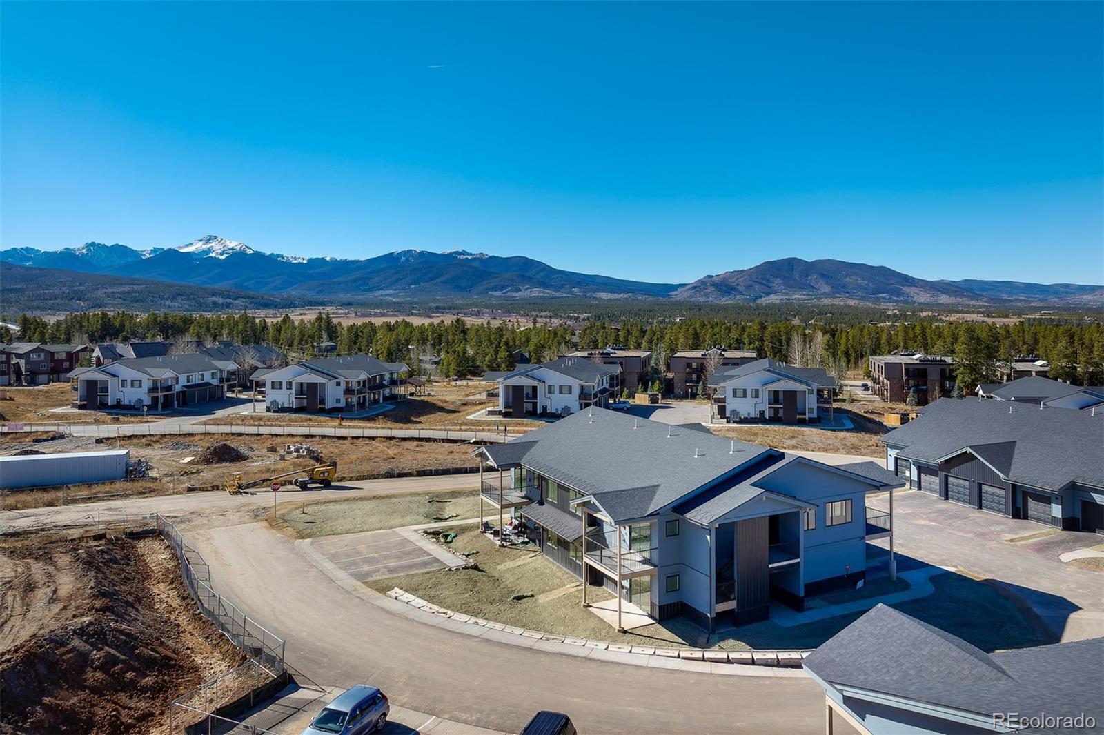 340 Sterling Loop, Unit 1 Fraser, CO 80442 - Photo 25 of 28 a view of a patio with couches under an umbrella