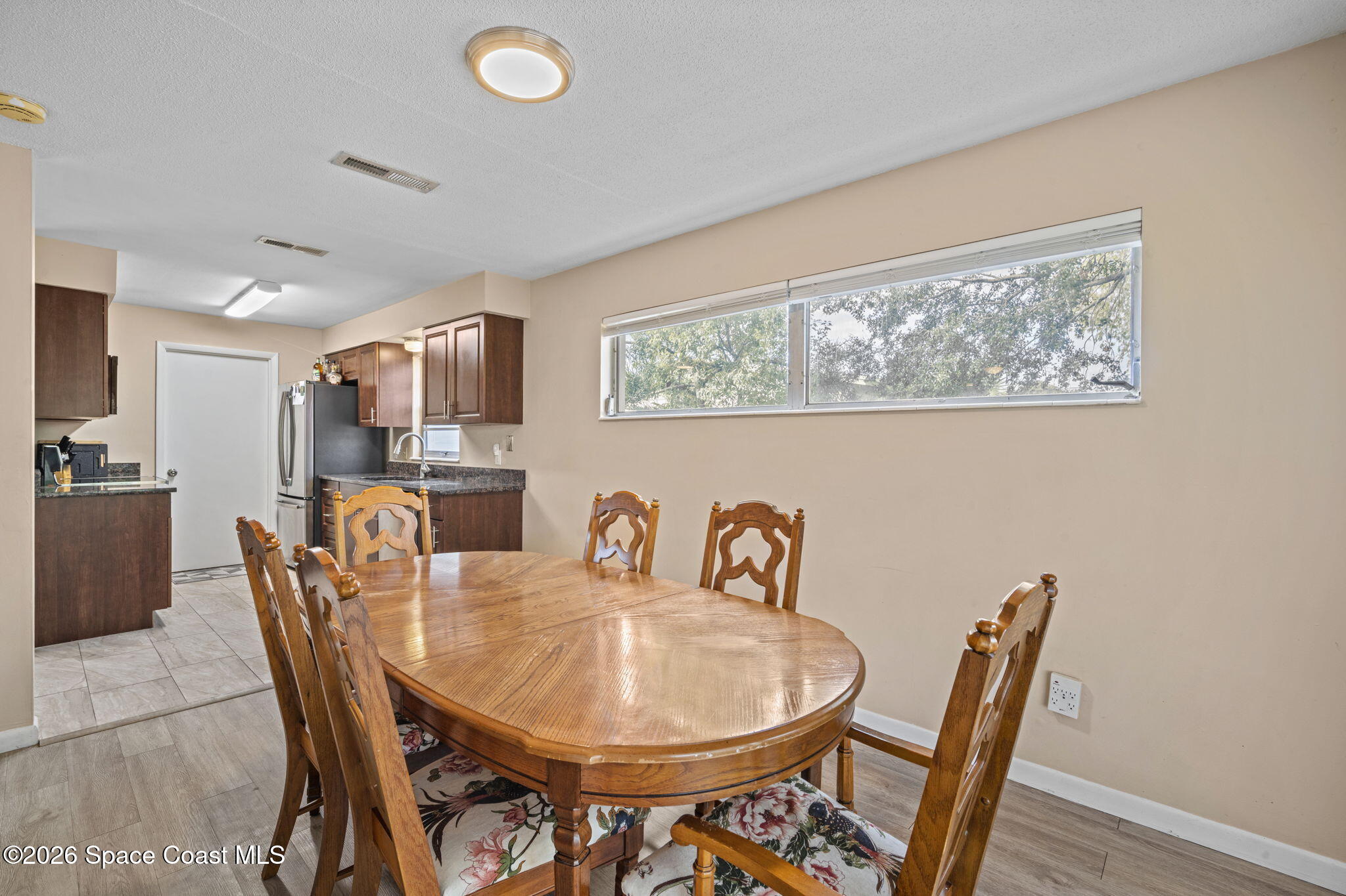 1088 Coronado Drive Rockledge, FL 32955 - Photo 13 of 23 a dining room with furniture and window