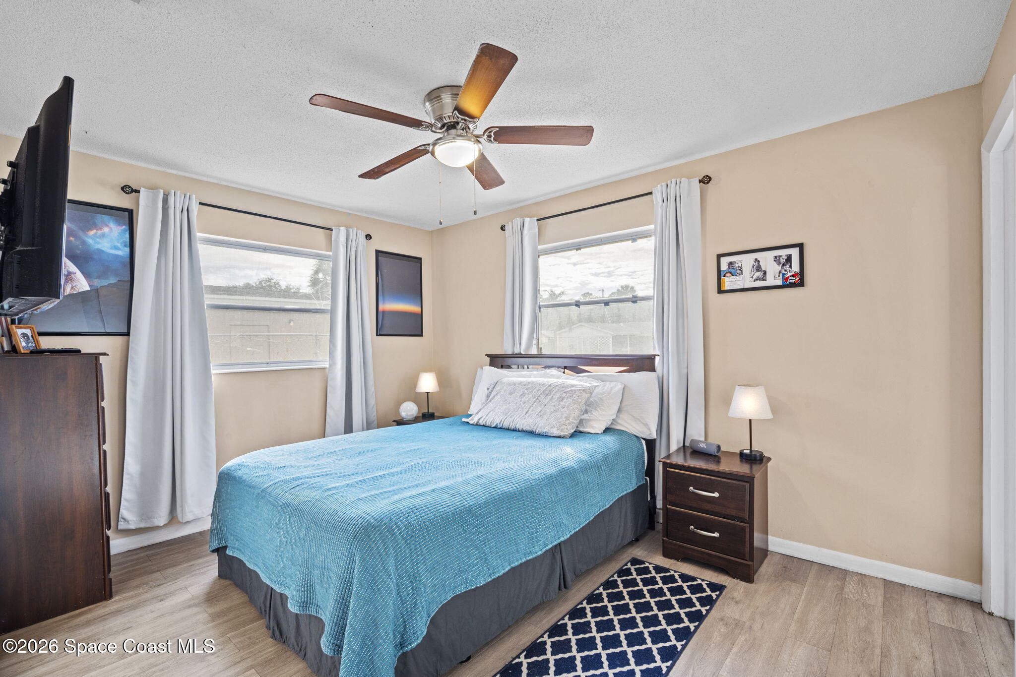 1088 Coronado Drive Rockledge, FL 32955 - Photo 15 of 23 a bedroom with a bed and wooden floor