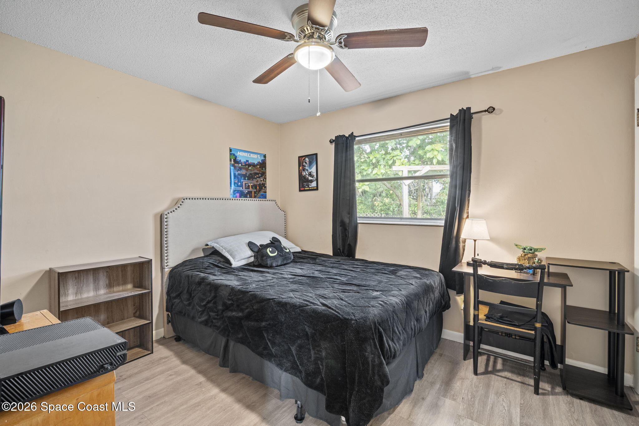 1088 Coronado Drive Rockledge, FL 32955 - Photo 19 of 23 a bedroom with a bed and a window