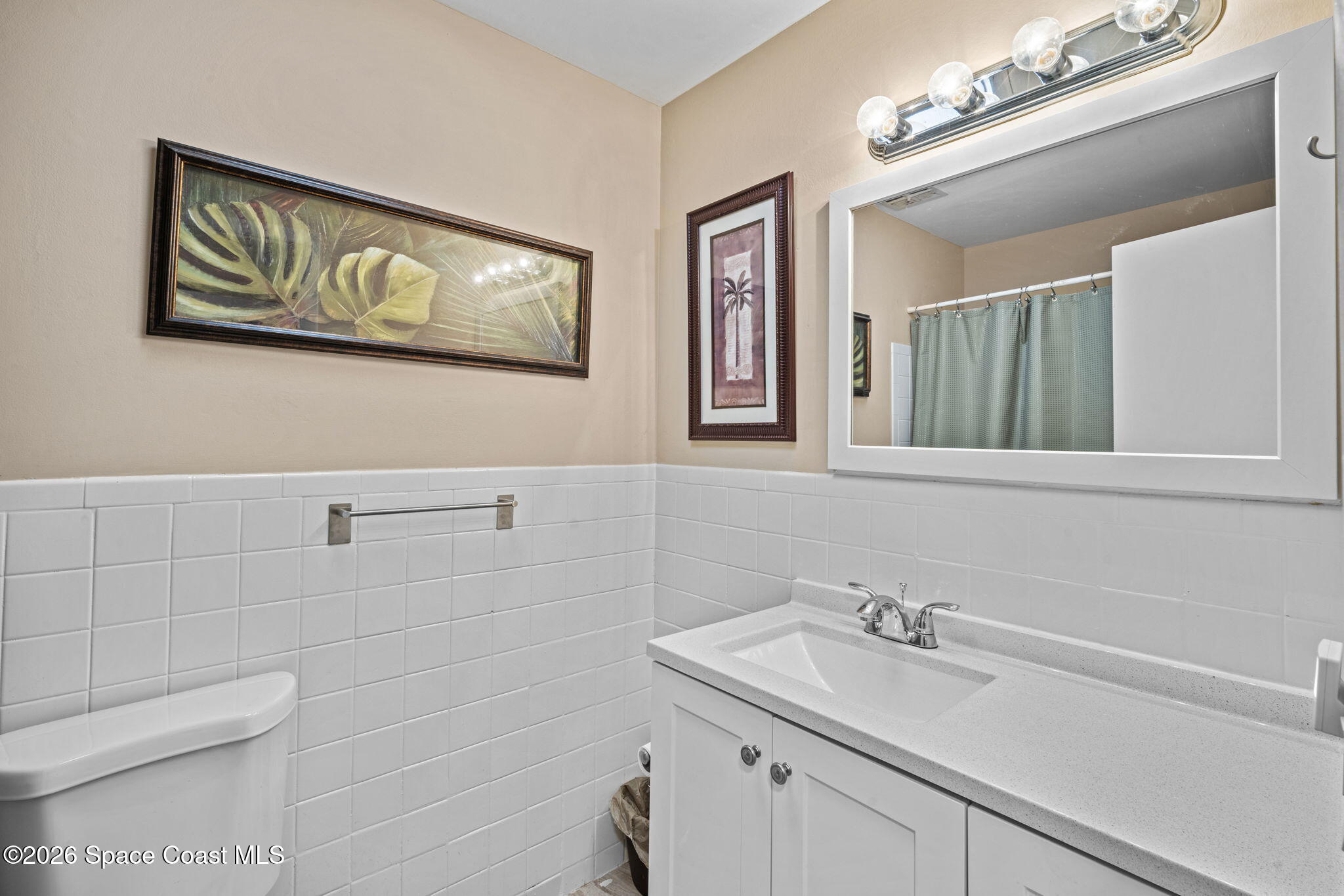 1088 Coronado Drive Rockledge, FL 32955 - Photo 20 of 23 a bathroom with a sink and a mirror