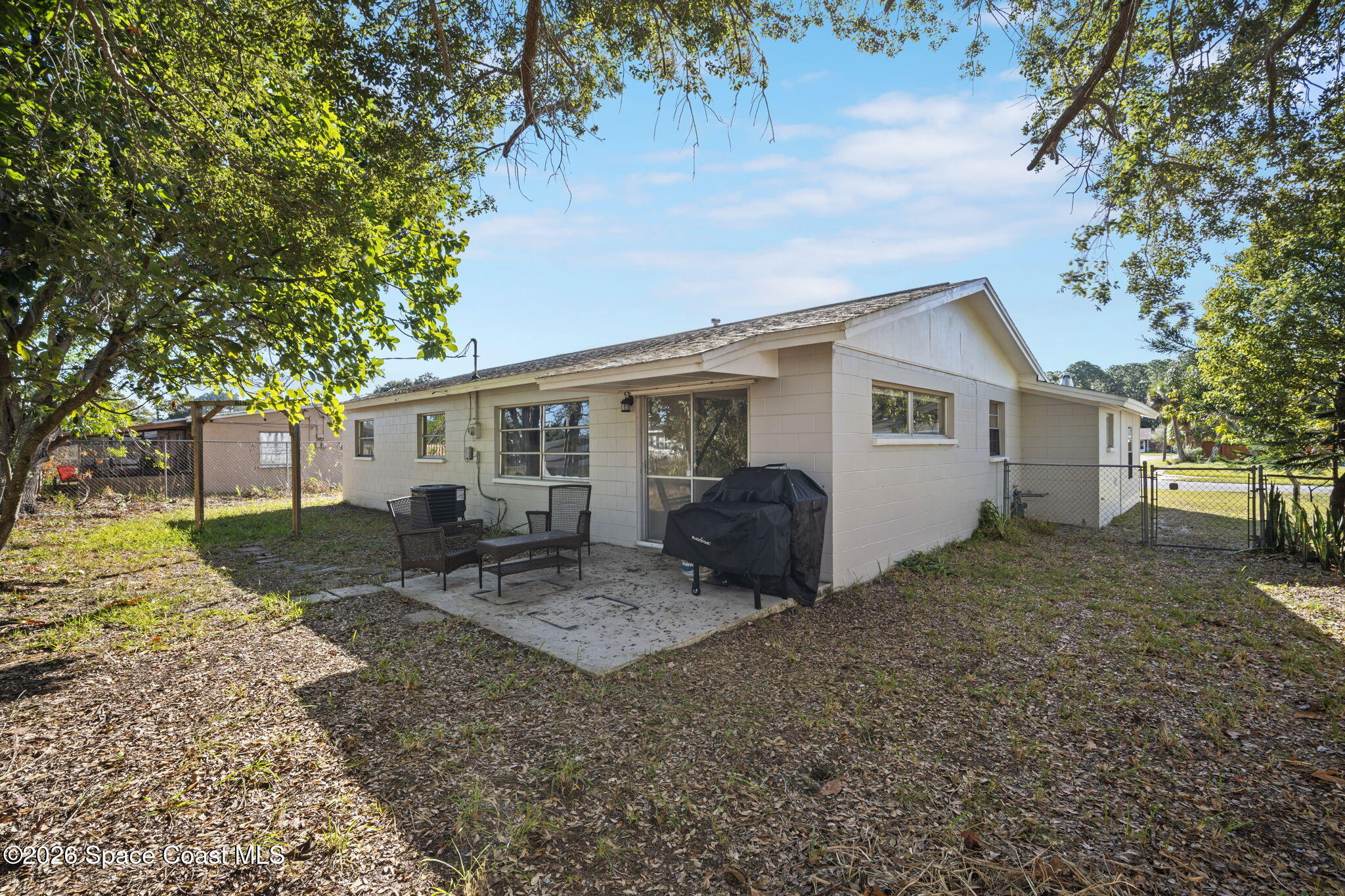 1088 Coronado Drive Rockledge, FL 32955 - Photo 22 of 23 a view of a house with backyard and sitting area