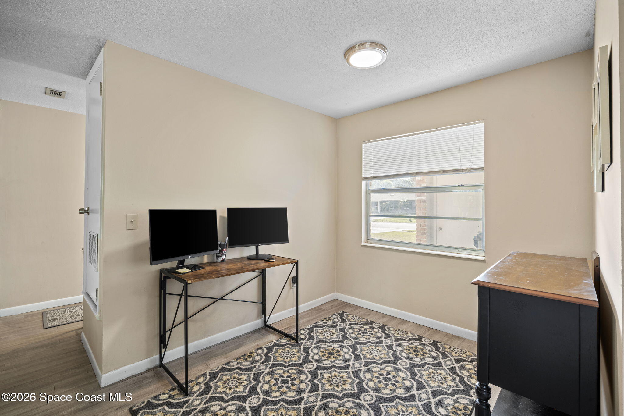 1088 Coronado Drive Rockledge, FL 32955 - Photo 8 of 23 a workspace with furniture and window