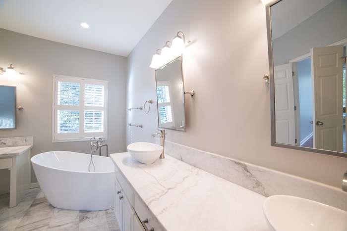 1925 Jesse Cronic Road Braselton, GA 30517 - Photo 35 of 58 a spacious bathroom with a tub sink and mirror