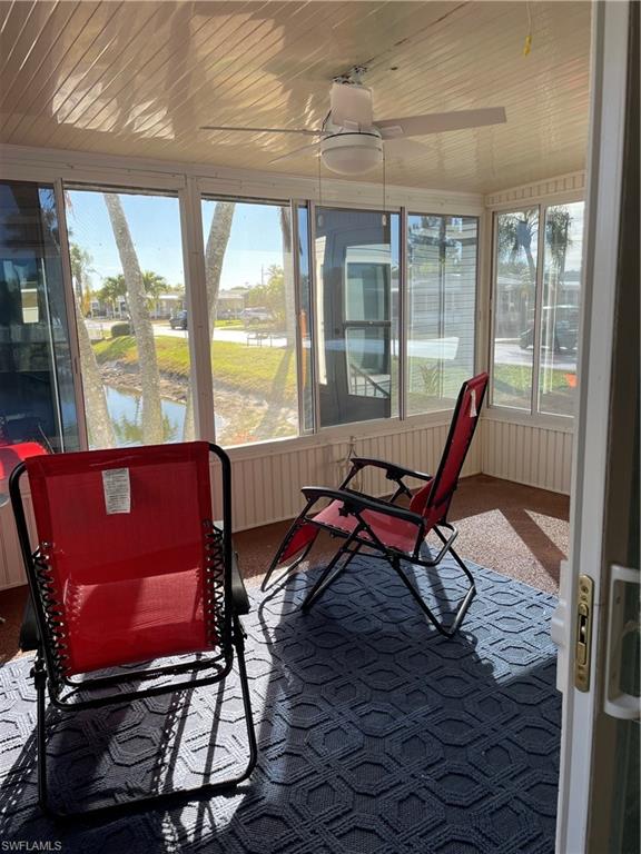 101 Oceans Boulevard, Unit 101 Naples, FL 34104 - Photo 13 of 14 a view of a room with furniture wooden floor and windows
