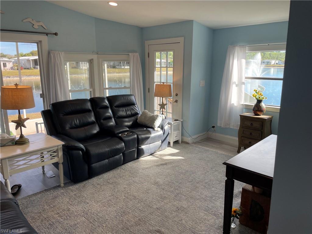 101 Oceans Boulevard, Unit 101 Naples, FL 34104 - Photo 3 of 14 a living room with furniture and a window