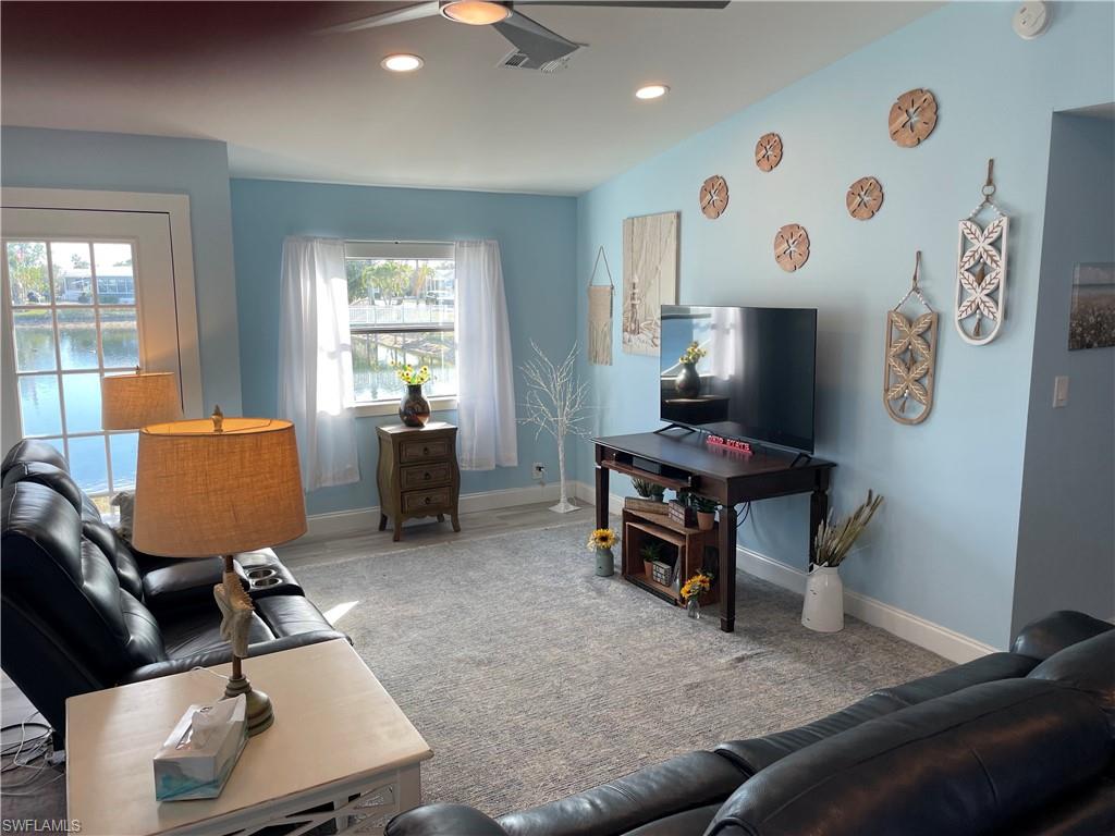 101 Oceans Boulevard, Unit 101 Naples, FL 34104 - Photo 4 of 14 a living room with furniture and a window