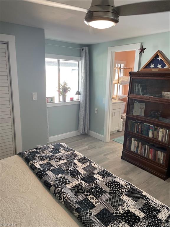 101 Oceans Boulevard, Unit 101 Naples, FL 34104 - Photo 7 of 14 a bedroom with a bed and a window