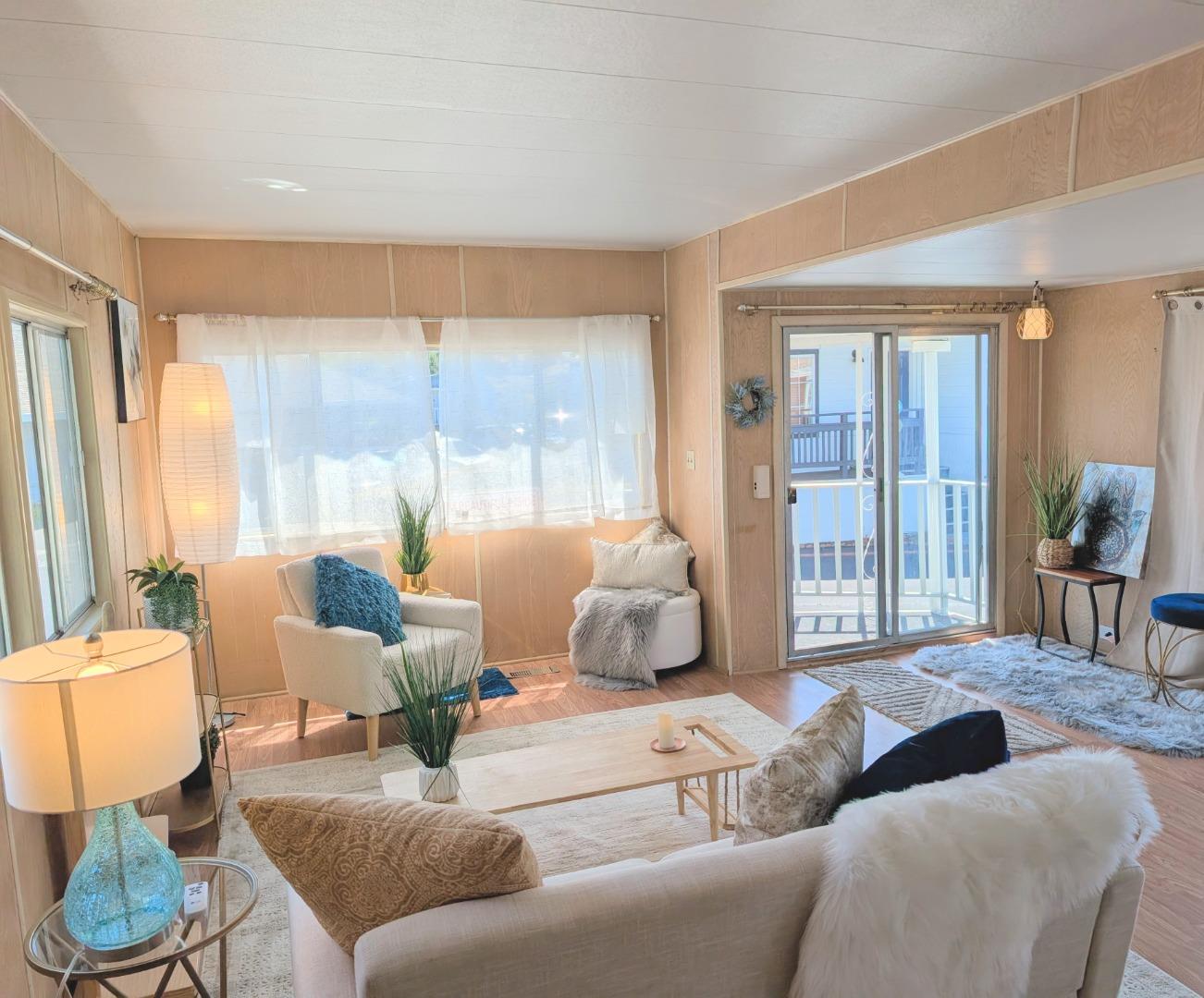 1201 Sycamore Terrace, Unit 148 Sunnyvale, CA 94086 - Photo 11 of 36 a living room with furniture and a large window