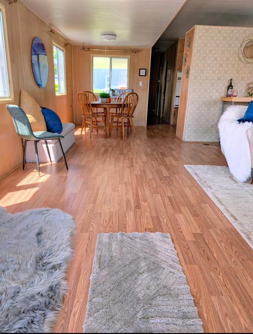 1201 Sycamore Terrace, Unit 148 Sunnyvale, CA 94086 - Photo 13 of 36 a living room with furniture and a wooden floor