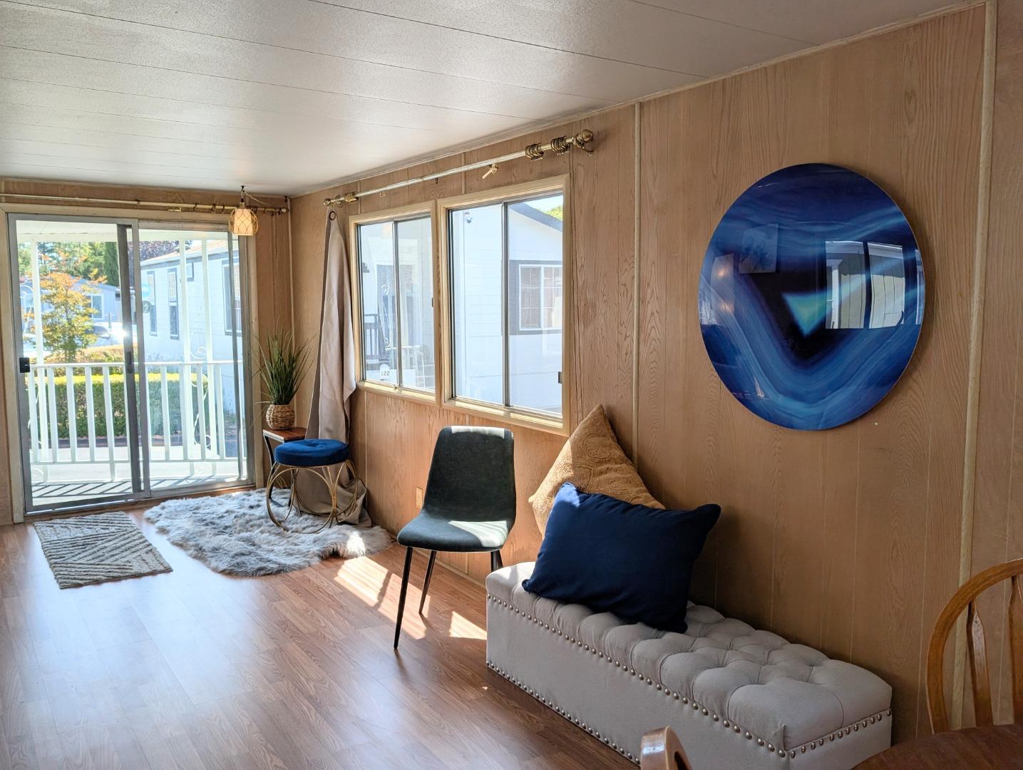 1201 Sycamore Terrace, Unit 148 Sunnyvale, CA 94086 - Photo 14 of 36 a living room with furniture and a window