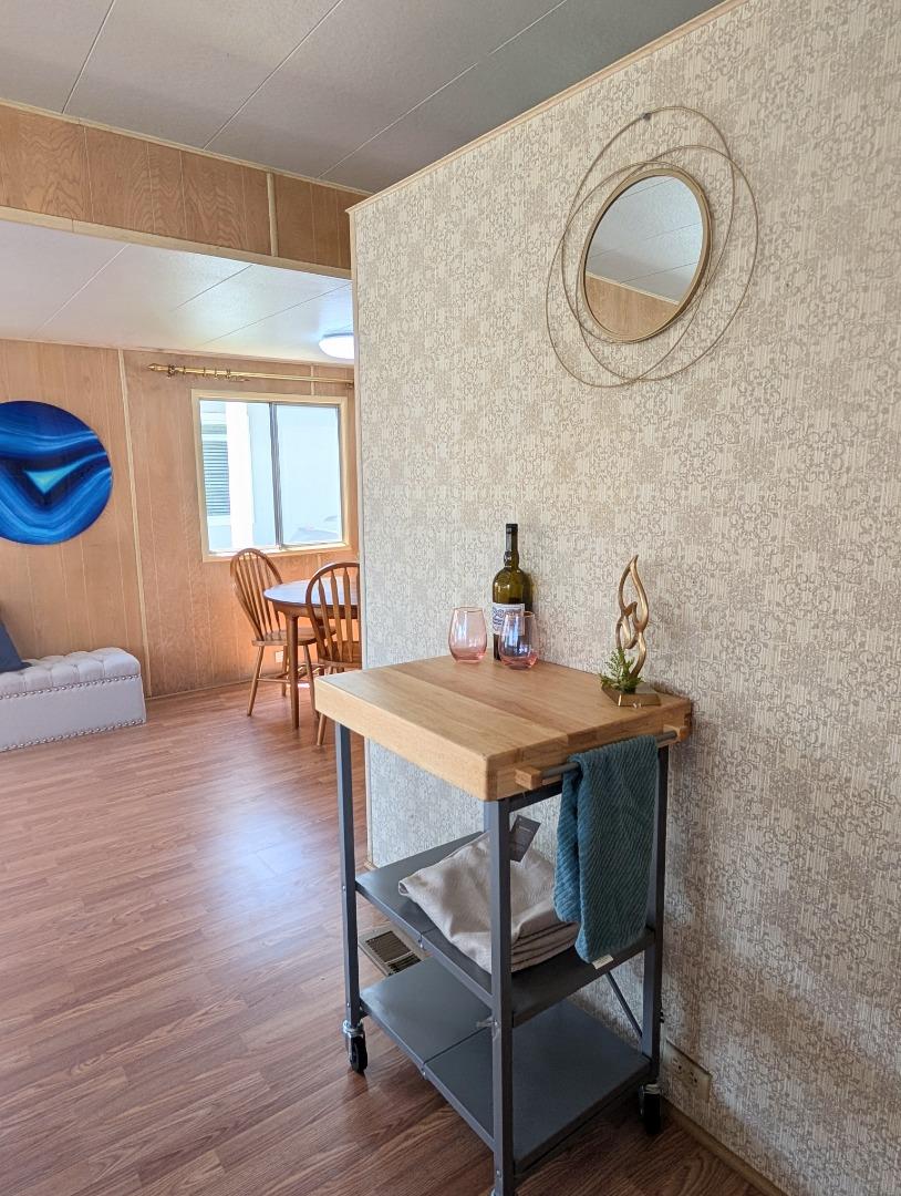 1201 Sycamore Terrace, Unit 148 Sunnyvale, CA 94086 - Photo 17 of 36 a dining room with furniture and wooden floor