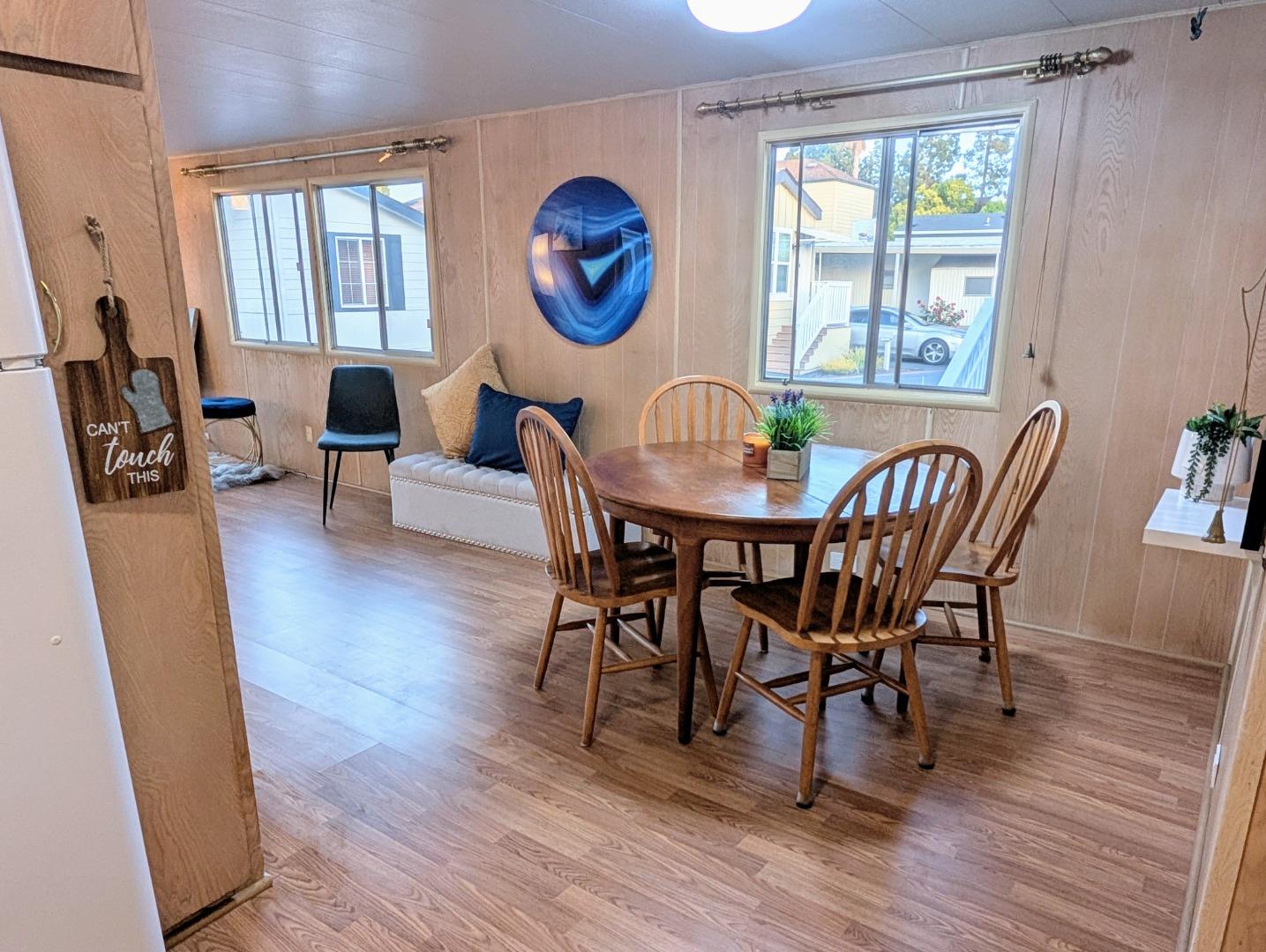 1201 Sycamore Terrace, Unit 148 Sunnyvale, CA 94086 - Photo 18 of 36 a view of a dining room with furniture window and wooden floor