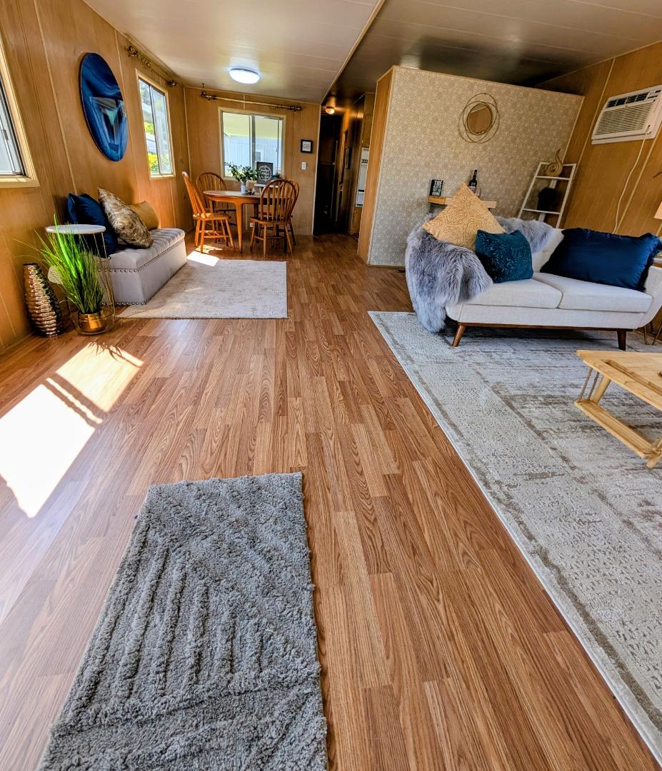 1201 Sycamore Terrace, Unit 148 Sunnyvale, CA 94086 - Photo 5 of 36 a living room with furniture and wooden floor