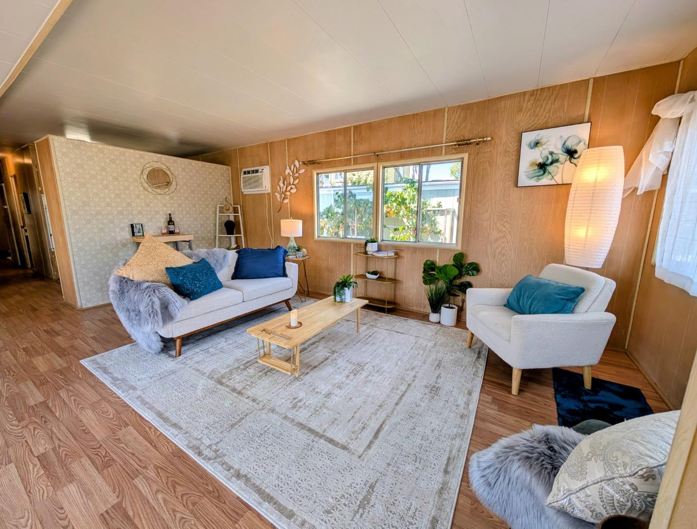 1201 Sycamore Terrace, Unit 148 Sunnyvale, CA 94086 - Photo 6 of 36 a living room with furniture and a large window