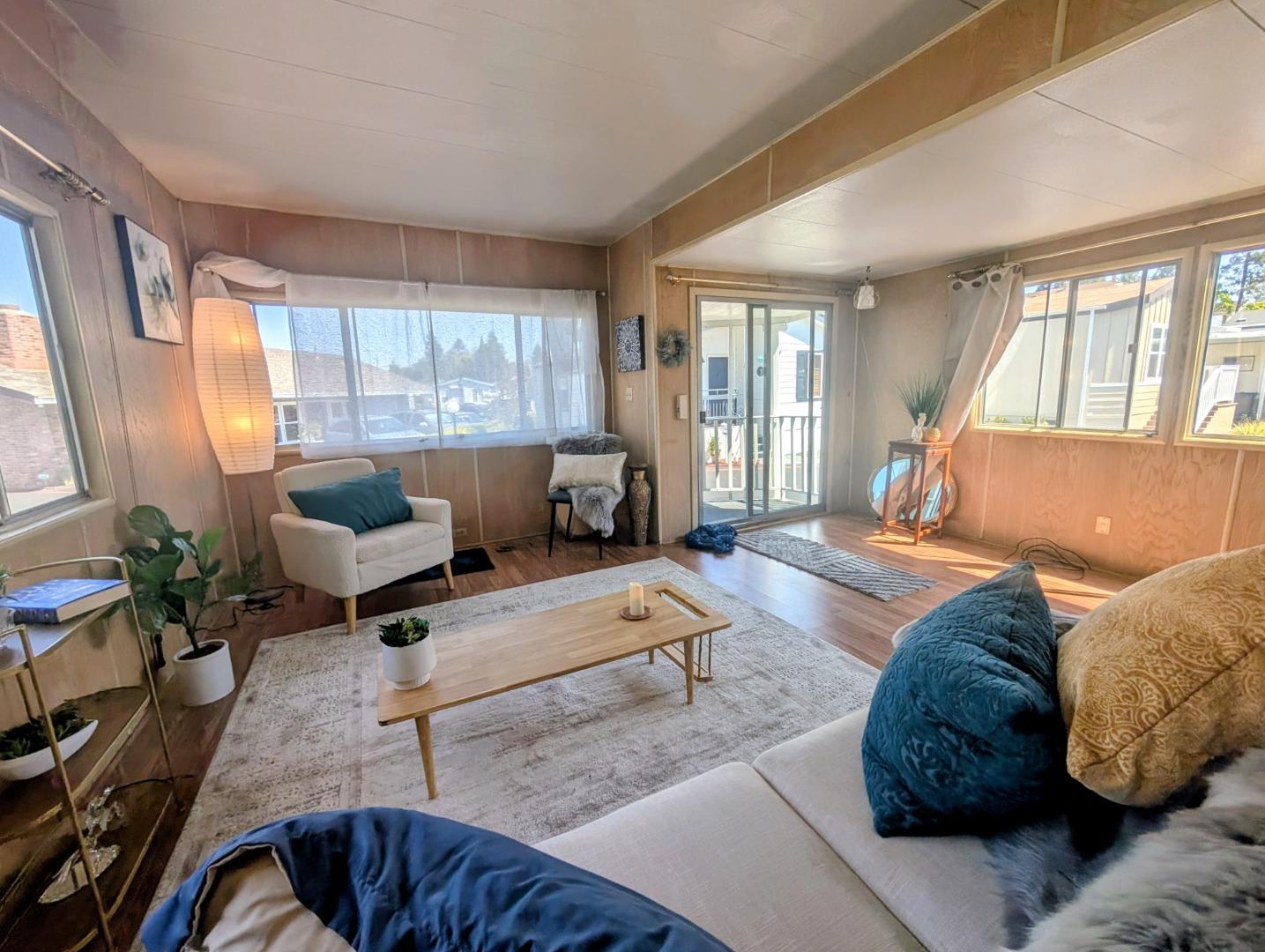 1201 Sycamore Terrace, Unit 148 Sunnyvale, CA 94086 - Photo 7 of 36 a living room with furniture and a large window