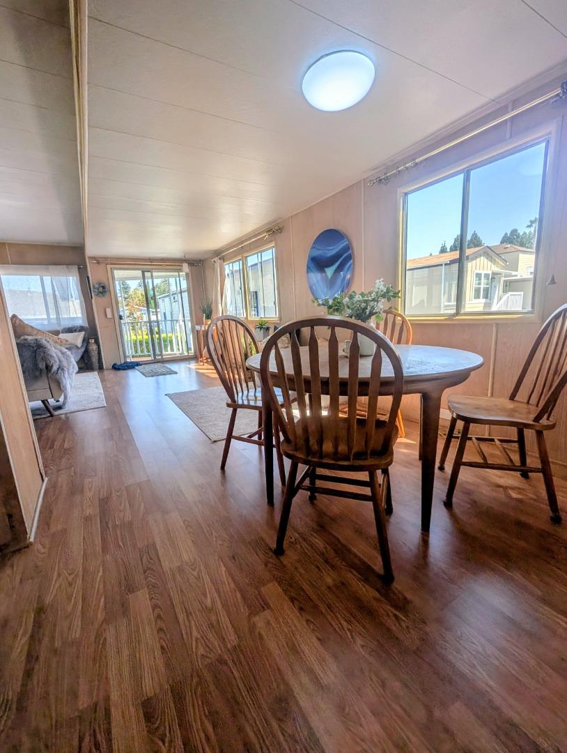 1201 Sycamore Terrace, Unit 148 Sunnyvale, CA 94086 - Photo 8 of 36 a view of a dining room with furniture window and wooden floor