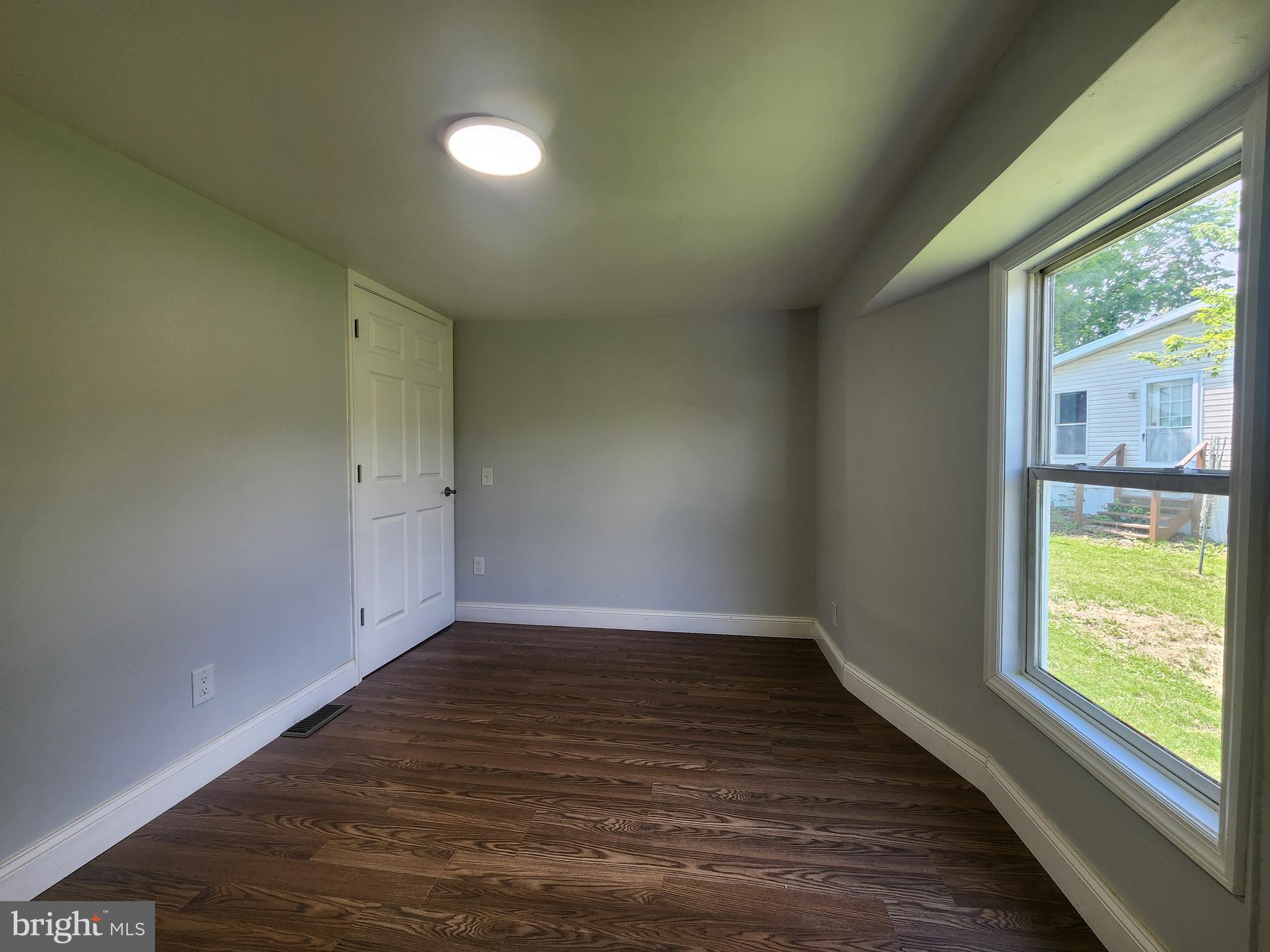 41 Mountain View Terrace Newville, PA 17241 - Photo 26 of 34 an empty room with wooden floor and windows
