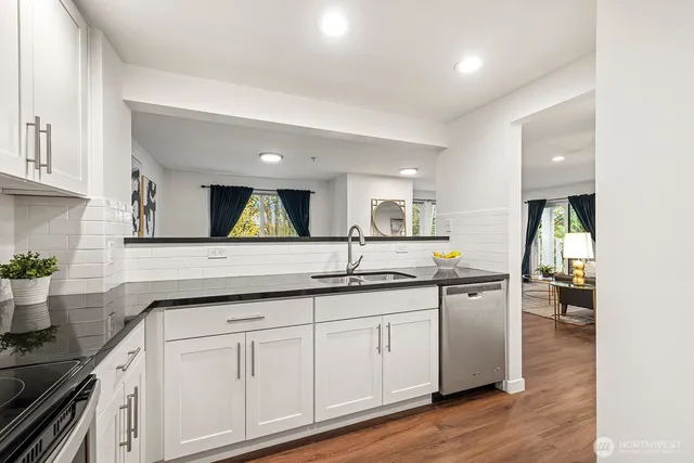 a kitchen with sink and cabinets