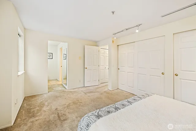 a bedroom with a bed and a shower